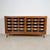 Originally functioning as a commercial sorting cabinet in mid-20th-century Germany, this solid pine piece has been...