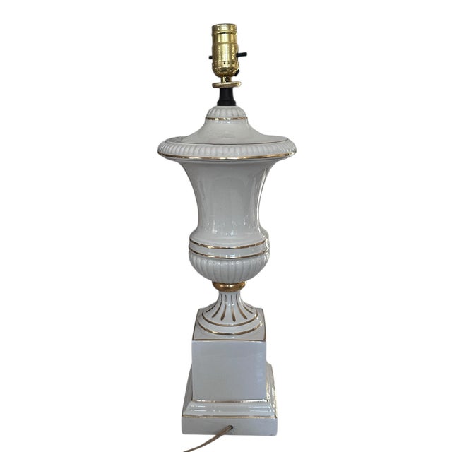 This elegant black and ivory transferware-style table lamp, attributed to Stiffel, features a classic baluster-form...