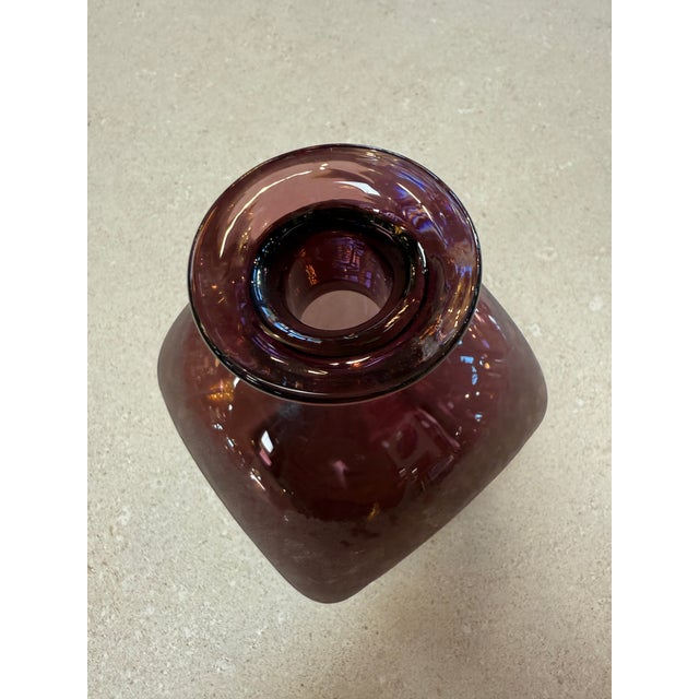 Striking Italian art glass vase from the 1970s featuring a rich amethyst tone and a sculptural square-rounded form. The...