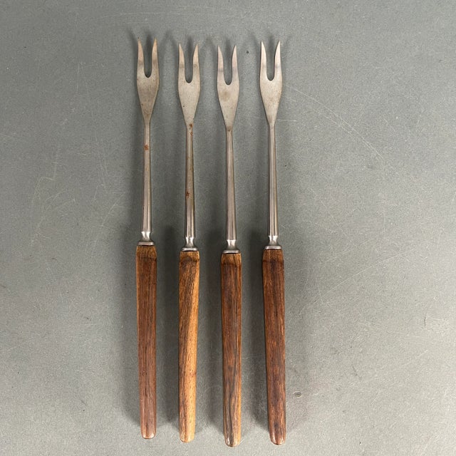 Mixed lot of 13 painted wood and teak handle fondue forks. 6 forks with color acrylic cap teak handles are 10.5" in...