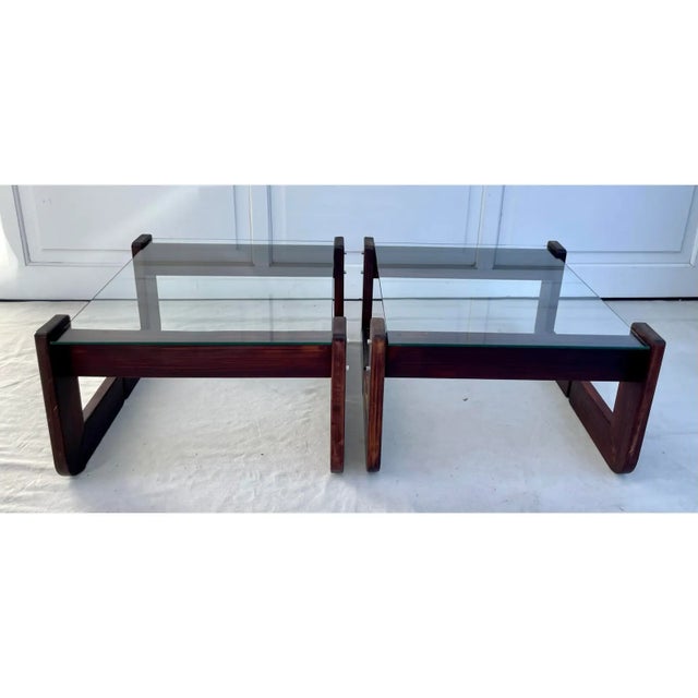 Here is a pair of 1970s Brazilian Modernist side tables by Percival Lafer, featuring sculptural, rich Brazilian rosewood...