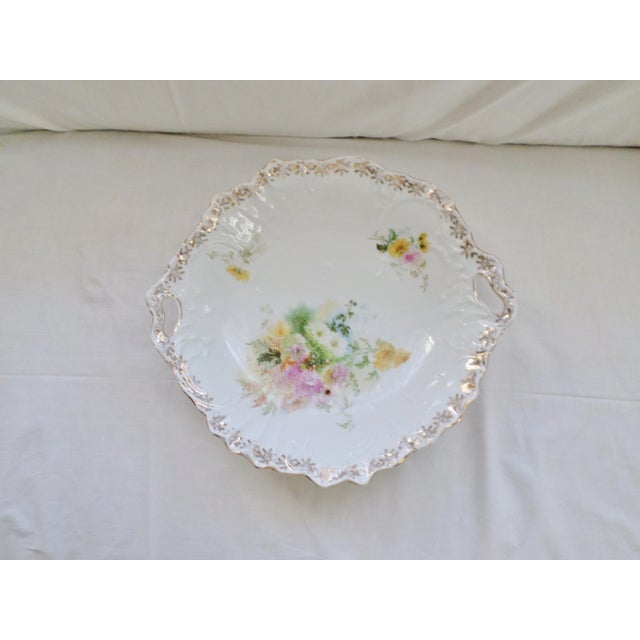 This is a German Carl Tielsch CT Porcelain Bowl with Handles and is Hand Painted Flowers thhat is 11.5" wide and 2.5""...