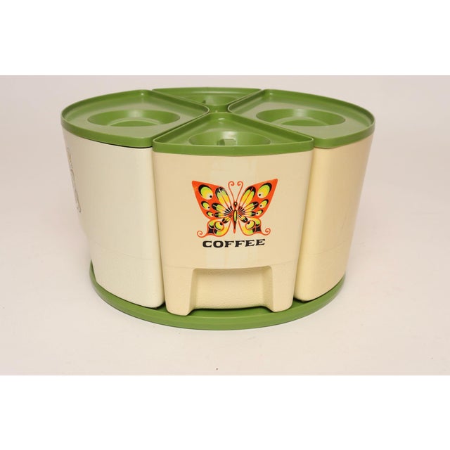 Vintage Sterilite 4-piece canister set (sugar, coffee, tea, flour) in cream with yellow, black, and orange butterfly motif...