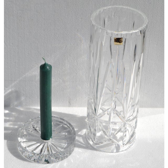 This Brilliant Cut Glass Hurricane Candle Holder with an underplate is a decorative and functional piece, crafted from 24%...