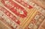 Midcentury Turkish rug with a double column scroll prayer motif on a deep red ground surrounded by an ivory border....