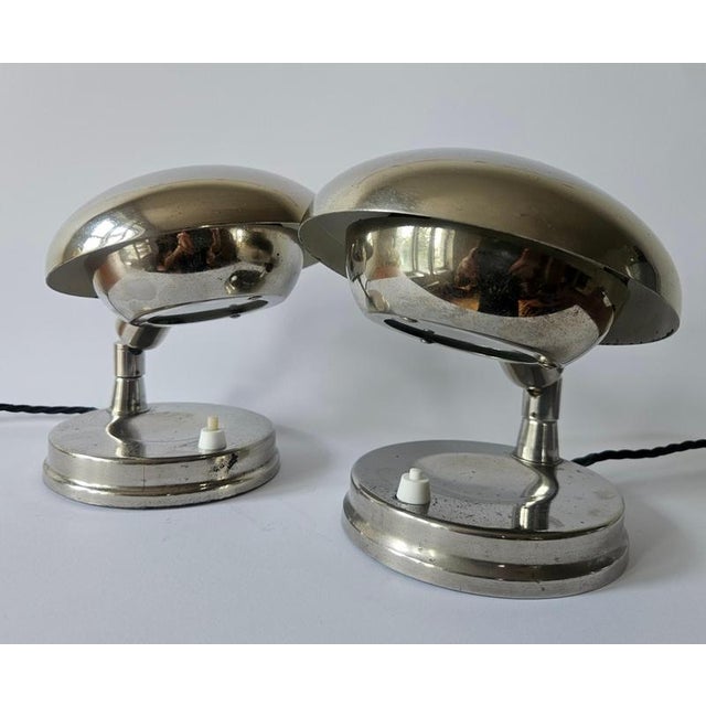 - extremely rare type / in pair - nice style of lighting - adjustable - patina of chrome This piece is attributed to the...
