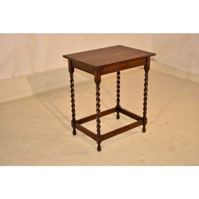 Period Edwardian oak side table from England, circa 1900. This oak side table is a lovely piece with a nicely figured top...