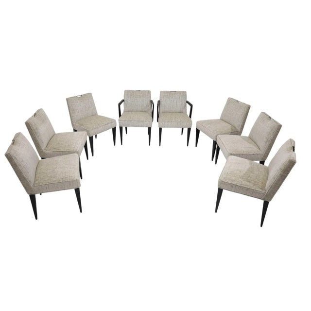 Experience the epitome of mid-century elegance with this set of eight dining chairs designed by Edward J Wormley for the...