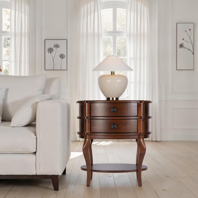 Charming in every curve, the Butler Specialty Company Ethel Oval Accent Table infuses your space with timeless elegance....