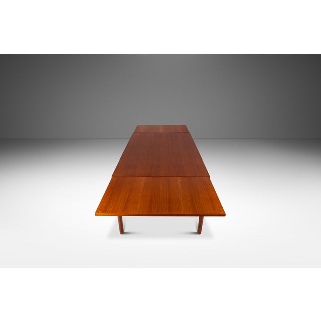 Introducing a highly functional, Danish-made expansion dining table designed by Henning Kjaernulf and built by the renown...