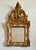 A gilded wood parclose mirror. The central mirror pane surrounded by eight smaller panels. French 18th century.