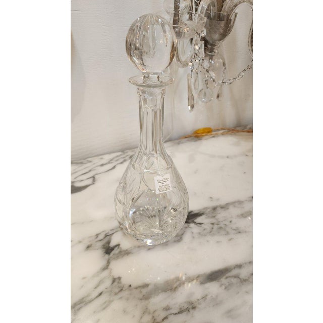 Vintage clear glass decanter with spherical topper, made in Czechoslovakia. A decanter is a vessel that is used to hold...
