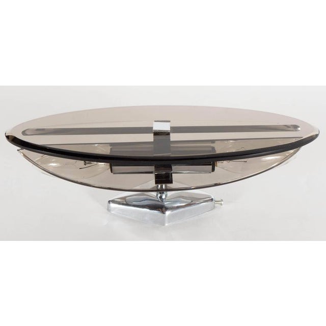 Manufacturer: Veca Dims.: 4"W x 3.5"D x 11"H Thick smoked, beveled glass half and full oval shades layered one against the...