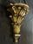 Extra large acanthus wall bracket with antiqued gold gilt finish with holes for hanging. Measures 13.5” wide, 7” deep and...