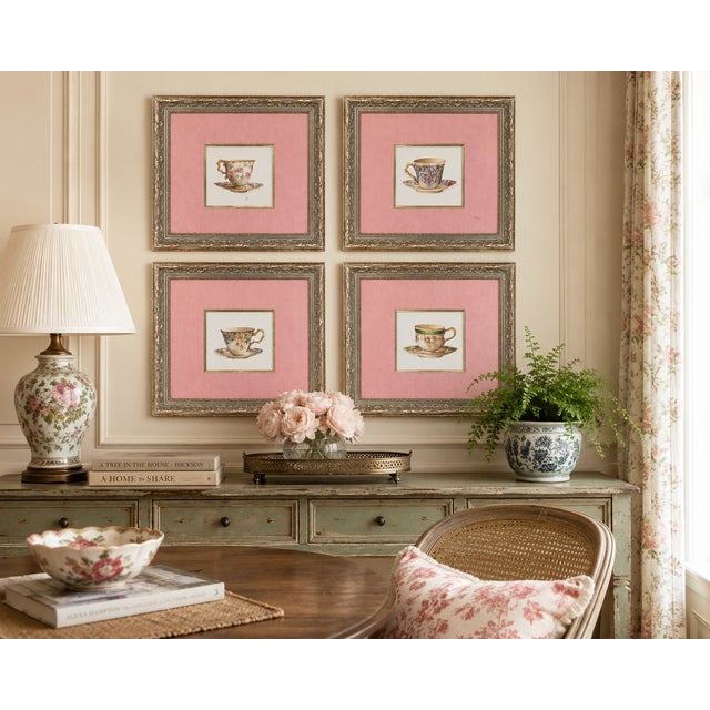 A charming set of four vintage framed teacup studies, each depicting a different porcelain cup and saucer decorated with...