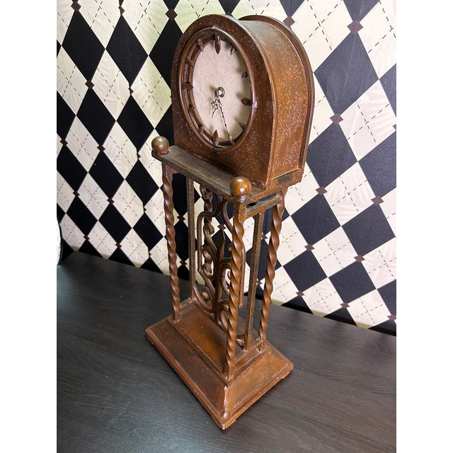 Oversized architectural table clock standing an impressive 25 inches tall, constructed in metal with an open framework of...