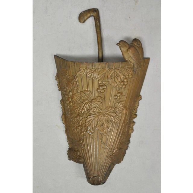 Antique French Art Nouveau Cast Metal Figural Umbrella Form Bird and Vine Wall Pocket. Circa Early 20th Century....