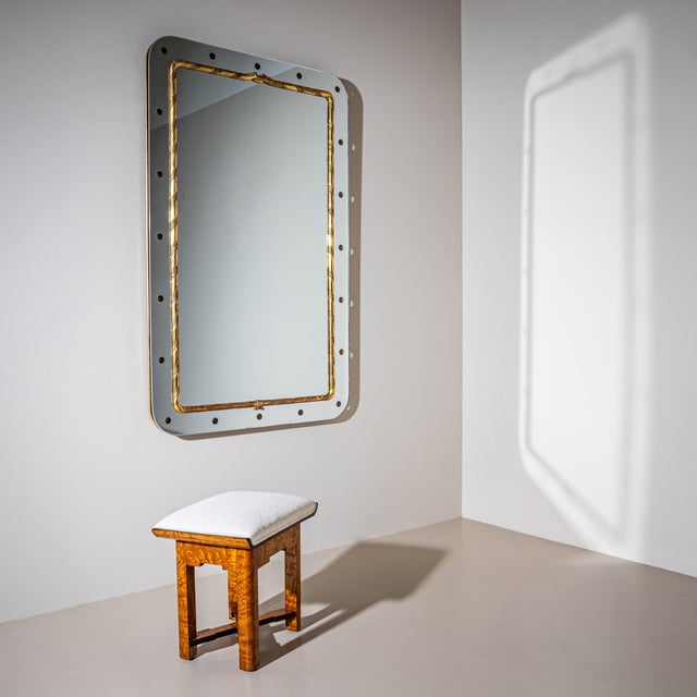 Large rectangular wall mirror with rounded corners and dotted decoration along the outer frame. The inner molding is made...