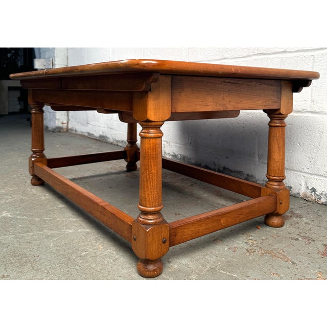 Elevate your living space with this stunning Stickley Maple Draw Leaf Coffee Table, a perfect blend of traditional...