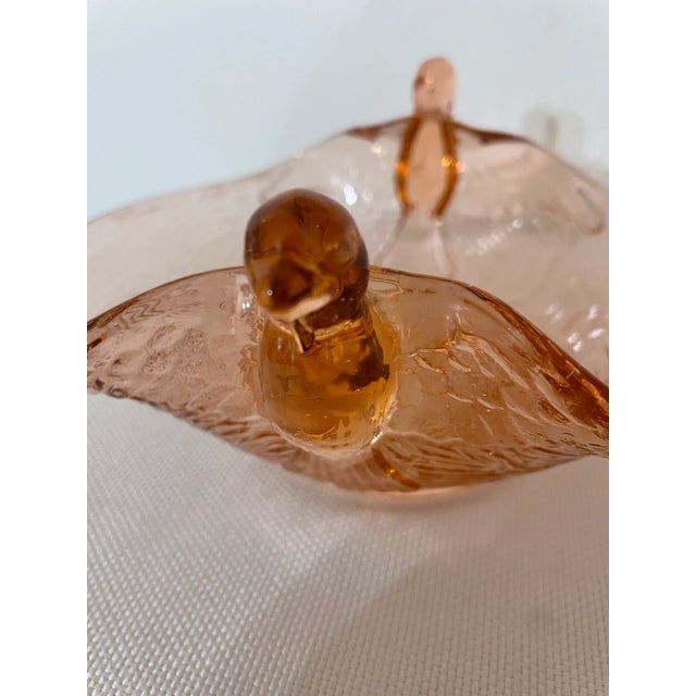 This Fenton blush pink depression glass bowl or candy dish is taken from pretty to amazing because of the pair of birds in...