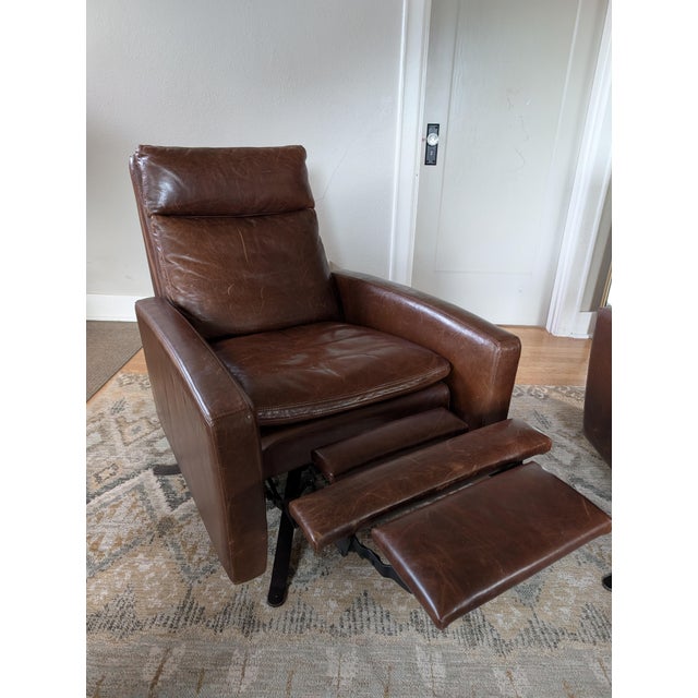 Modern library chair on a swivel. Gently used, but much loved American Leather "Simon" recliners. Burnished bronze swivel...