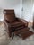 Modern library chair on a swivel. Gently used, but much loved American Leather "Simon" recliners. Burnished bronze swivel...