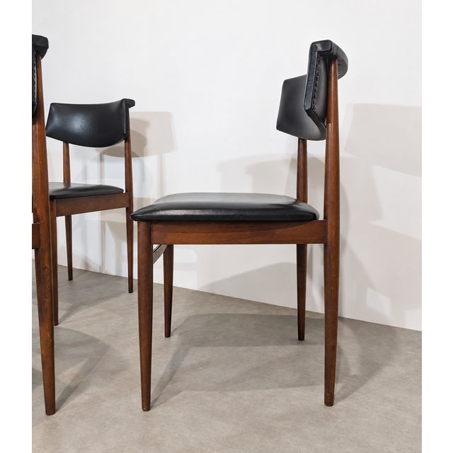 Set of six vintage dining chairs dating from the 1960s. The chairs feature a slender Mid-Century design with tapered legs,...