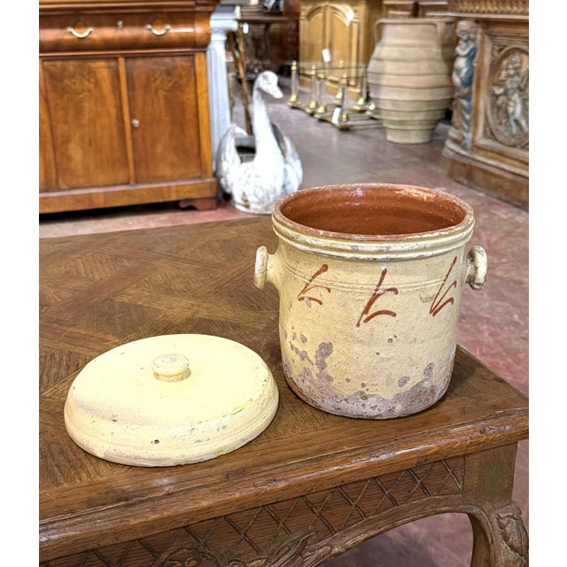 Rustic and full of character, this antique French confit pot reflects the traditional utilitarian pottery of Provence....