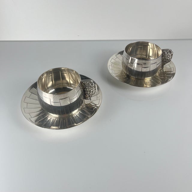Pair of Art Deco silver-plated cups and saucers, attributed to Corbière & Vuillermoz, France, circa 1920/30. Three...