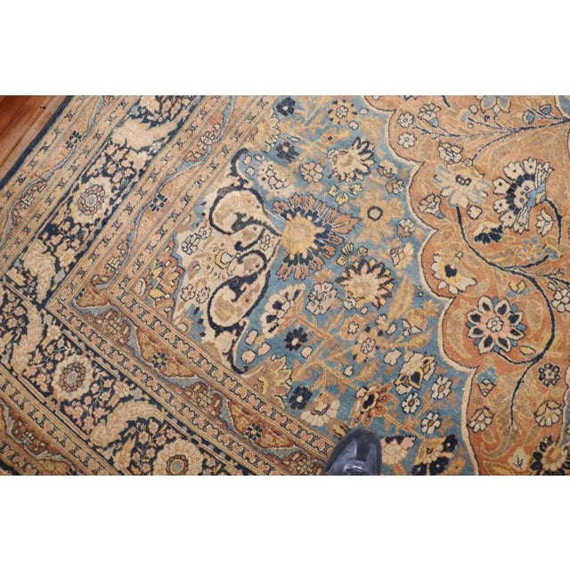 An exquisite early 20thcentury Persian Tabriz rug, light blue field and medallion with shades of apricot, ivory, and...