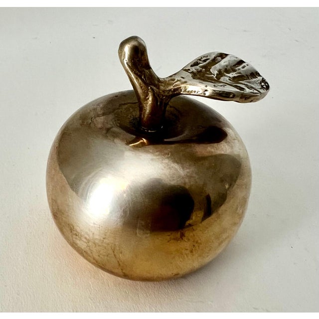 A Brass Apple and a bell. A novel piece, perhaps for the desk or work station, or babies room.. and always a gift for your...