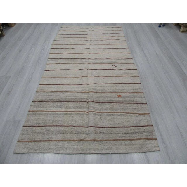 Vintage striped kilim rug from Adana region of Turkey.Approximately 45-55 years old. In good condition