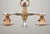 This is a delightful Victorian-inspired bare-bulb chandelier dating from the mid-20th century. It is a prime example of...