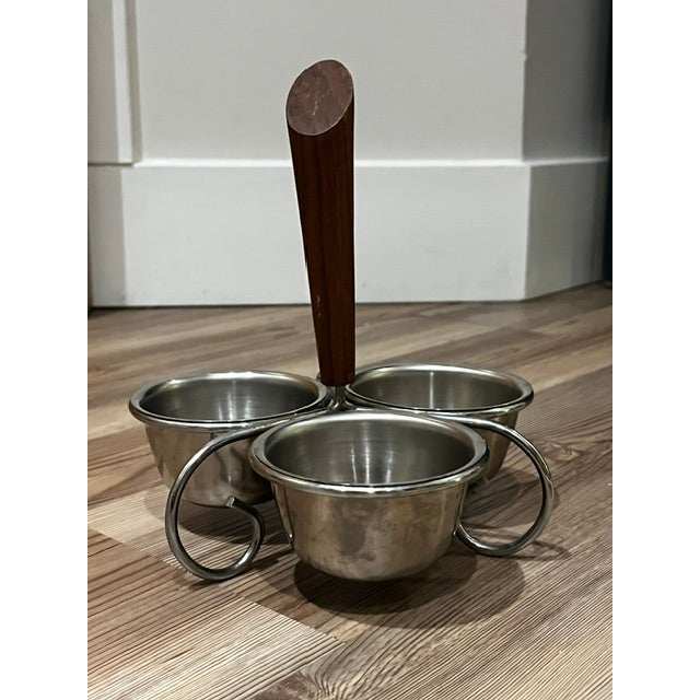 vintage mid-century modern stainless steel and wood condiment caddy featuring three removable serving bowls and a central...