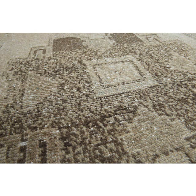 Vintage Hand-Knotted runner rug is a semi-antique vintage area rug. The '70s Eastern region of Anatolia's unique rug is...