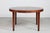 Large round dining table with three leaves designed by Ole Wanscher (1903-1985). The table is made of mahogany with matte...