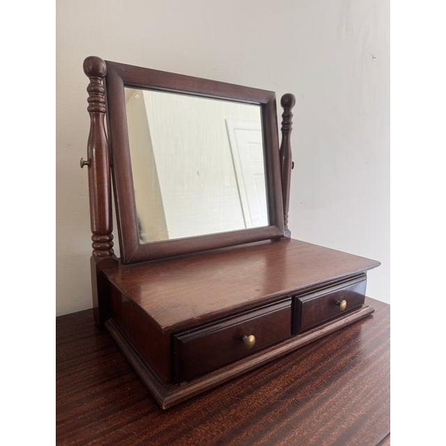 Listing is for a Federal style mahogany table or dresser top shaving mirror. The mirror is on a swivel and is mounted on a...