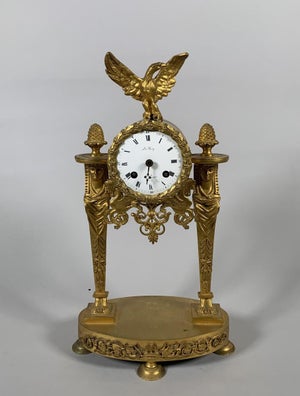 Empire period portico clock with Egyptian motifs, gilt bronze, circa 1800, 19th century
