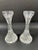 An elegant pair of Baccarat Masséna crystal candlesticks, finely crafted in France and bearing the acid-etched Baccarat...