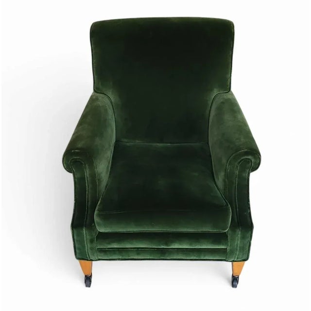 Invite exceptional comfort into your home with this handcrafted British rolled arm club chair, upholstered in sumptuous...