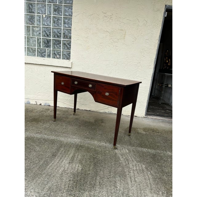 Handsome 19th century British colonial server handcrafted in mahogany with brass hardware, string inlays and elegant...