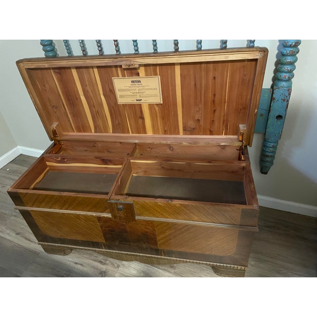 Spiegel Heirloom Cedar Chest fully lined. Locking lid, inner drawers swing out. Needs refinish work/ scratches on lid. Age...