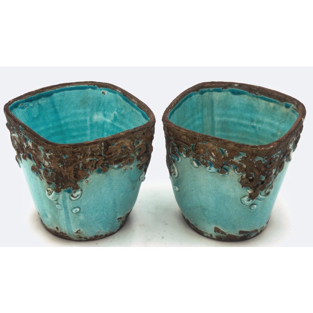 A sculptural pair of Italian artisan cachepots by Arte Italica, featuring hand-formed earthenware construction with...