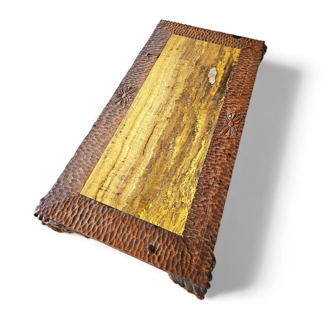 Coffee table Crafted by hand in Italy / This piece features a dark wood tone and an ornate decor theme with 4 faces on the...