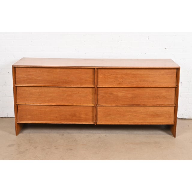 An exceptional Mid-Century Modern walnut six-drawer dresser or credenza In the manner of George Nakashima By T.H....