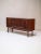 Beautiful vintage sideboard from Denmark, 1960s, a rare kingwood highboard featuring a striking, expressive grain pattern....