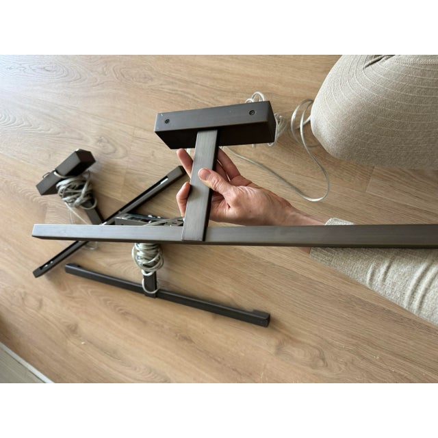 3 modern picture lights that are adapted to plug in bronze finish. 4 Halogen bulbs in each. Selling as a set From Astro....