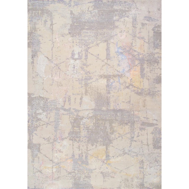 The Modern Collection explores hand-knotted designs through abstract patterning, solid tonal fields, and subtle surface...