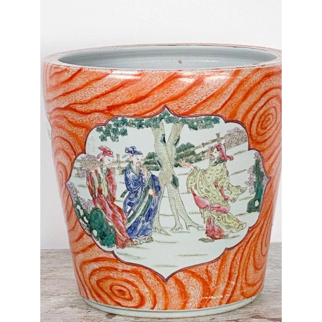 A rare large Chinese cachepot without stand, faux bois with court scenes in lozenges. Probably China, circa 1910.