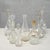 This set of eight vintage glass bottles and decanters, dating back to the mid-20th century, represents an interesting...